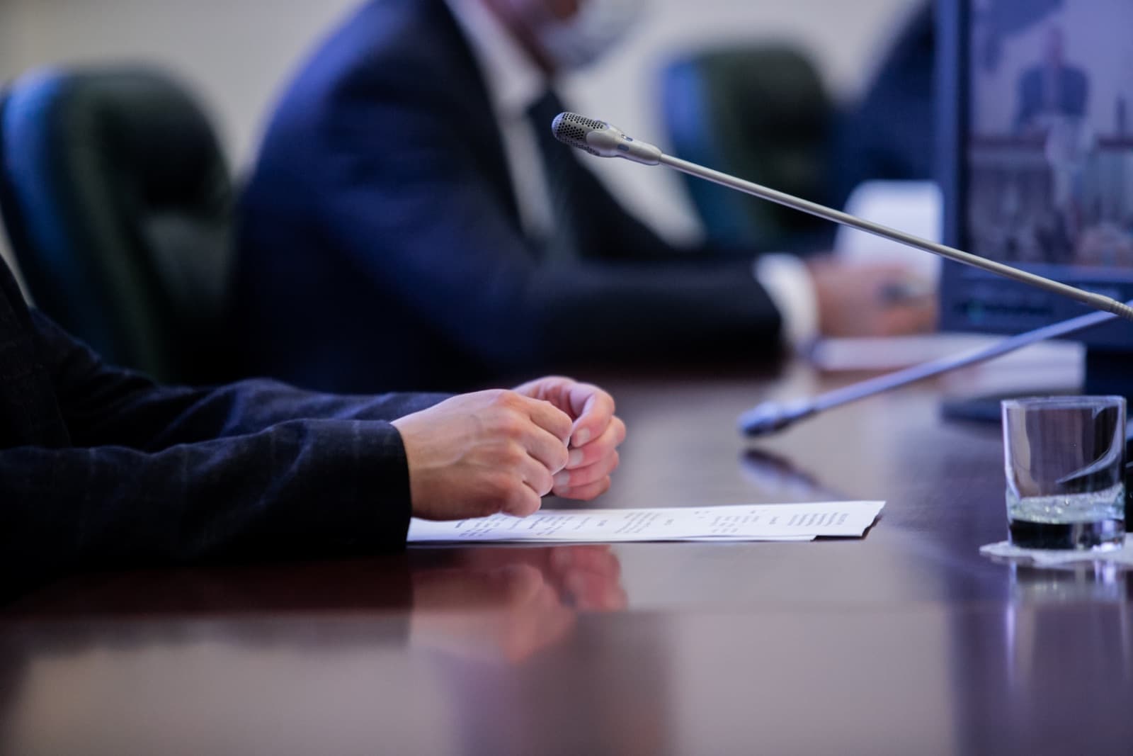 Microphones along a committee room table