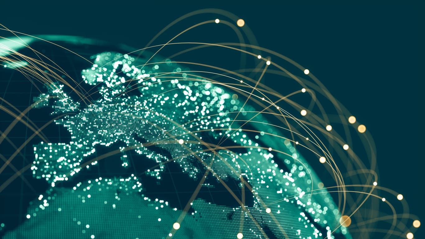 Lines of light connecting cities across a globe